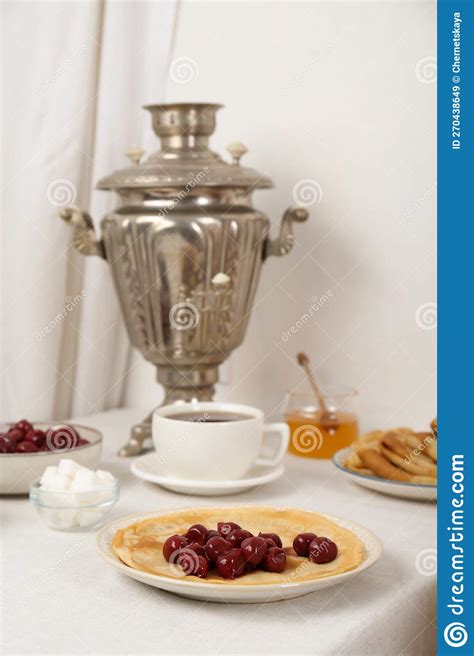 Vintage Samovar Cup Of Hot Drink And Snacks Served On Table