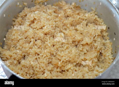 Cooked White Egyptian Rice By Hot Steam And Gained The Brown Color From