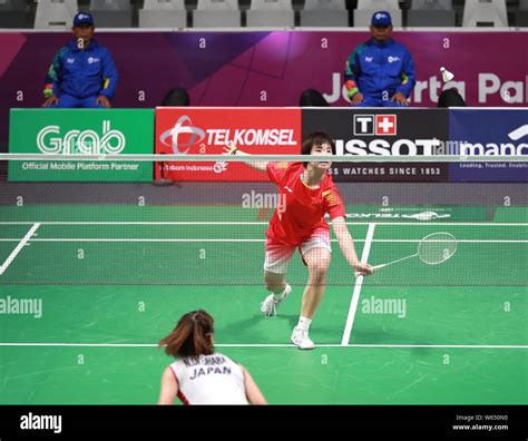 He Bingjiao Of China Returns A Shot To Nozomi Okuhara Of Japan In Their