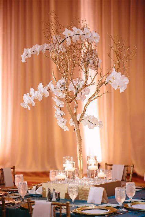 Gold Branches And Orchid Centerpiece