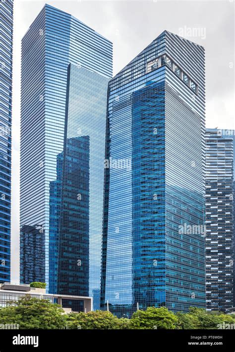 Glass High Skyscrapers In The Center Of Singapore On The Waterfront