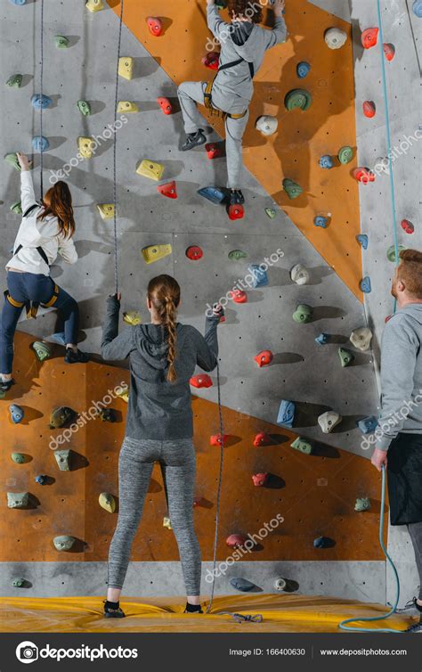 Two little kids climbing wall — Stock Photo © ArturVerkhovetskiy #166400630