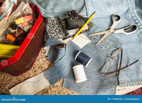 Set Of Tailoring Tools Accessories And Fabric On Table Stock Photo