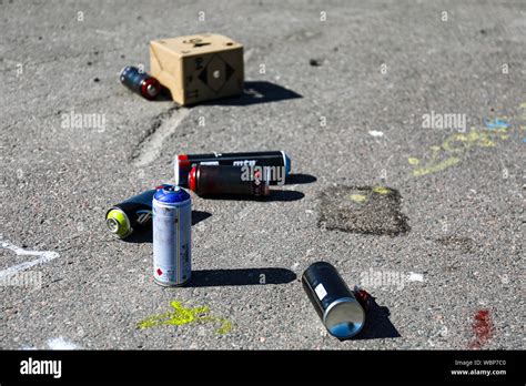 Empty spray paint cans discarded by graffiti artists Stock Photo - Alamy