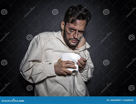 Young Creepy Man With Face Scars And A White Mask Dressed In A Phantom