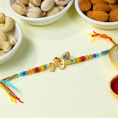 Buy Golden Divine Rakhi With Dry Fruits Gift Online At