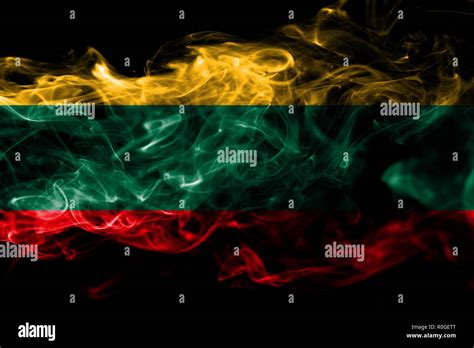 National Flag Of Lithuania Made From Colored Smoke Isolated On Black Background Abstract Silky