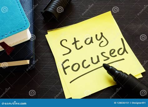 Stay Focused Handwritten On A Memo Stick And Notepad Stock Image