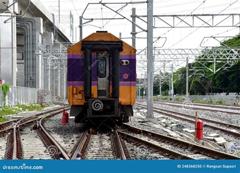 The Trains Running On The Train Tracks To The Station In Thailand