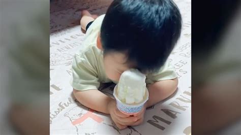 Baby eating ice cream while falling asleep is the cutest thing