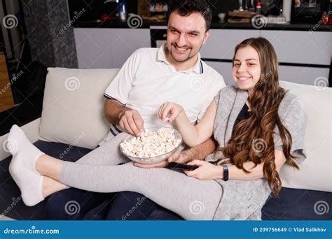 Happy Couple Eating Popcorn And Watching Tv At Home Stock Image Image