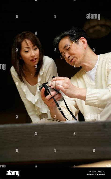 Mature Man Showing Woman Camera Stock Photo Alamy