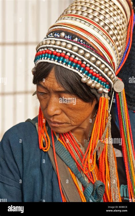 Akha Tribal Woman With Headdress At Xiding Market Yunnan China Stock