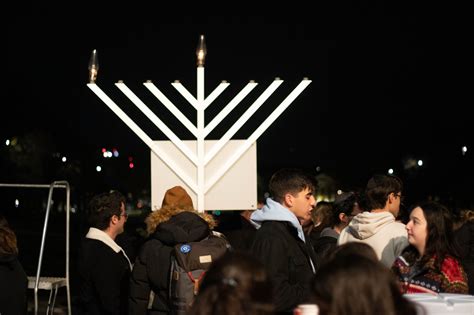 UMD community members gather for 10-foot menorah lighting to celebrate ...