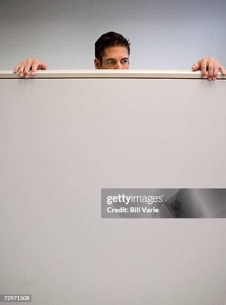 Man Peering Over Wall Photos And Premium High Res Pictures Getty Images