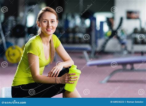 Portrait Of Young Woman Resting After Workout At Gym Stock Image