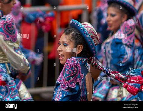 Caporales dancers in ornate costumes performing as they parade through the mining city of Oruro ...