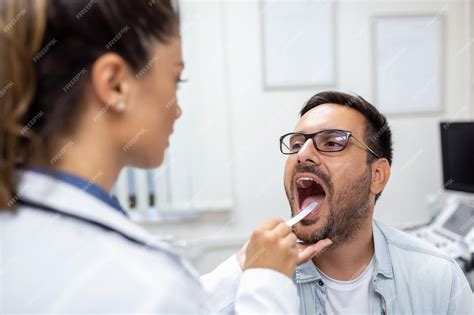 Premium Photo Male Patient Opening His Mouth For The Doctor To Look