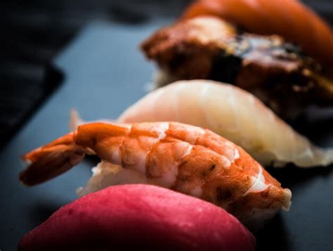 Premium Photo Close Up Of Sashimi Sushi Set On Black Tray