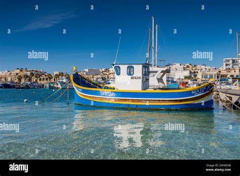 Traditional Maltese Fishing Boat In Marsaxlokk Village Stock Photo Alamy