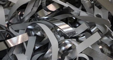 Silver Strips Of Foil And Paper After Children`s Paper Show Stock Photo