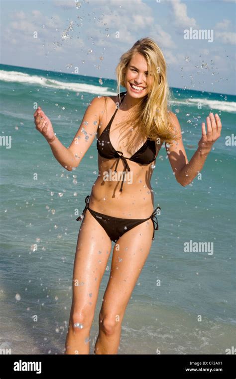 Female Very Long Blonde Hair Wearing Brown Halter Neck Bikini Standing