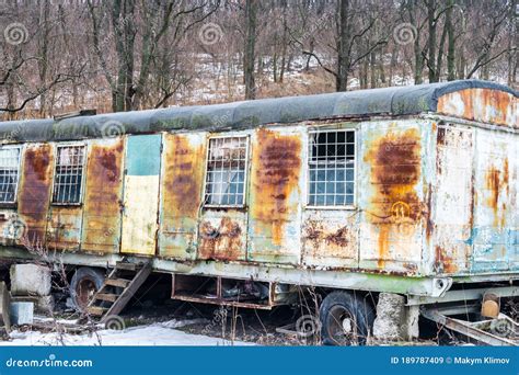 An Old Rusty Railway Car On Wheels Is Located In The Forest Stock Image