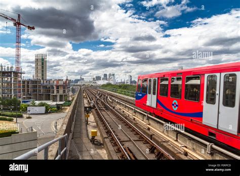 A Dlr Train Departing From Pontoon Dock Dlr Station On The Docklands