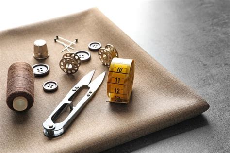 Premium Photo Set Of Tailoring Tools Accessories And Fabric On Table