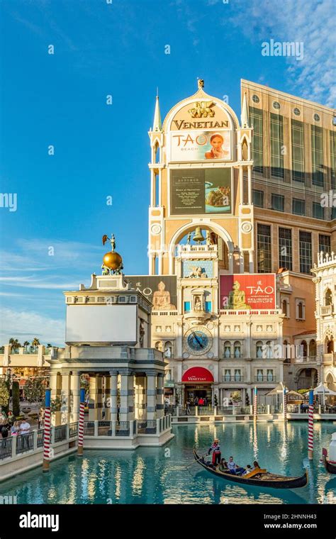 tourists enjoy gondola ride at the venetian hotel and casino in Las ...