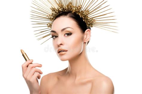 Glamorous Naked Model In Golden Headpiece Holding Lipstick Stock Photo