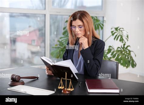 Beautiful Female Lawyer Working In Office Stock Photo Alamy