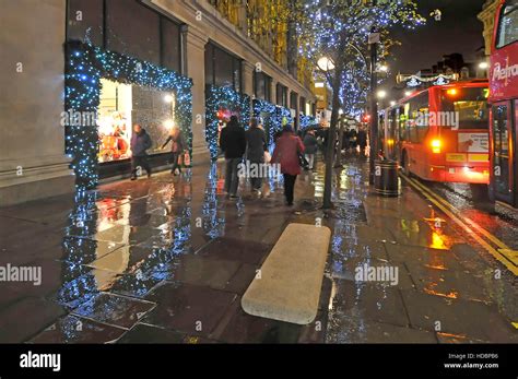 Rainy Day In London Uk Oxford Street With Xmas Shoppers And Christmas