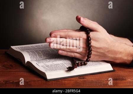 Russian Open Holy Bible With Wooden Cross On Black Backround Stock