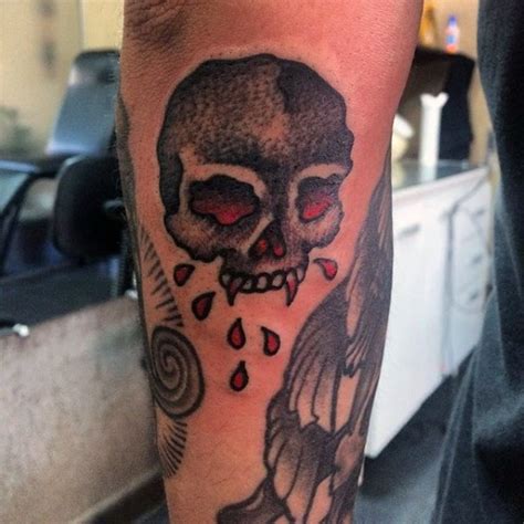 Bloody colored old school skull tattoo on arm - Tattooimages.biz