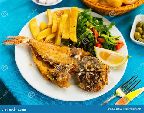 Roasted Lionfish With Potatoes And Fresh Greens Stock Photo Image Of