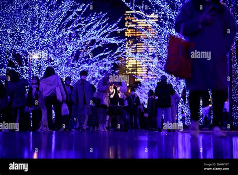 Pedestrians Walk Through Aoi Dokutsu Blue Cave On The Street From