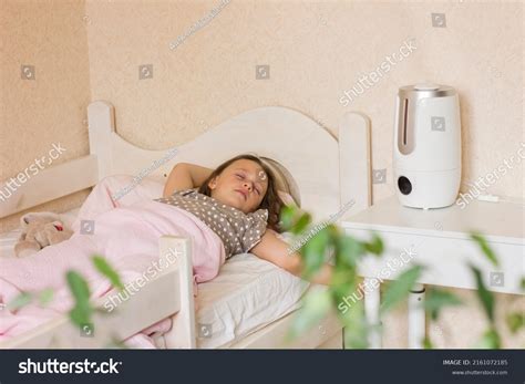 Cute little girl sleeping in bedroom with air - Royalty Free Stock ...