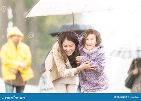 Mother And Child Under Umbrella In Rainy Weather Stock Photo Image