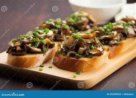 Mushroom Bruschetta Topped With Finely Chopped Scallions Stock Photo