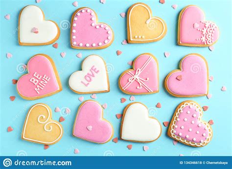 Composition With Decorated Heart Shaped Cookies On Color Background