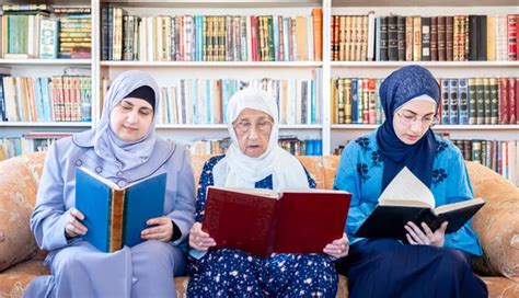 Happy Muslim Grandmother Her Granddaughter Sitting Together Couch Using