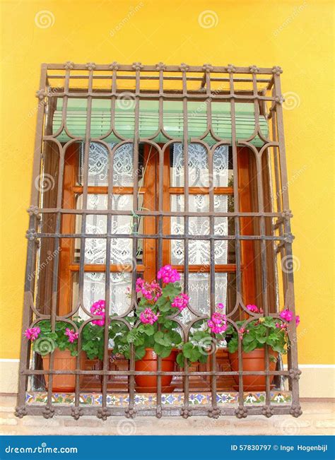 Mediterranean Balcony With Flowers And Handicrafts Curtains Stock Image