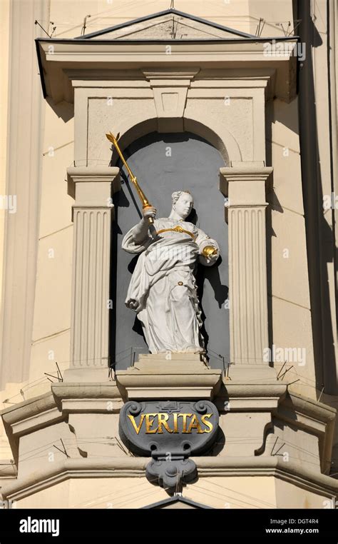 Statue of Veritas, the goddess of truth, on the baroque facade of the ...