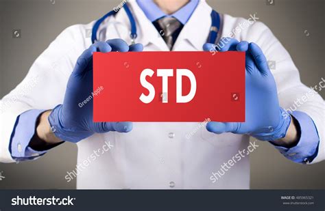 Doctors Hands In Blue Gloves Shows The Word Std Sexually Transmitted