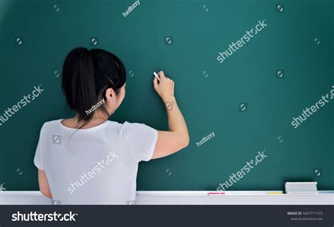 Woman Teacher Writing On Blackboard Stock Photo Shutterstock