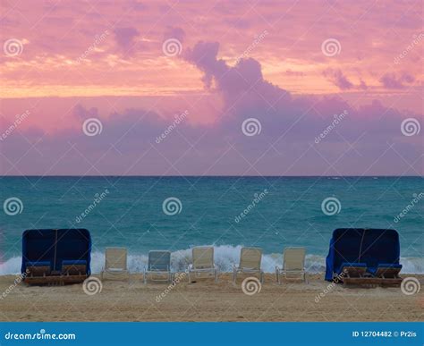 Beachfront at sunset stock photo. Image of vacations - 12704482