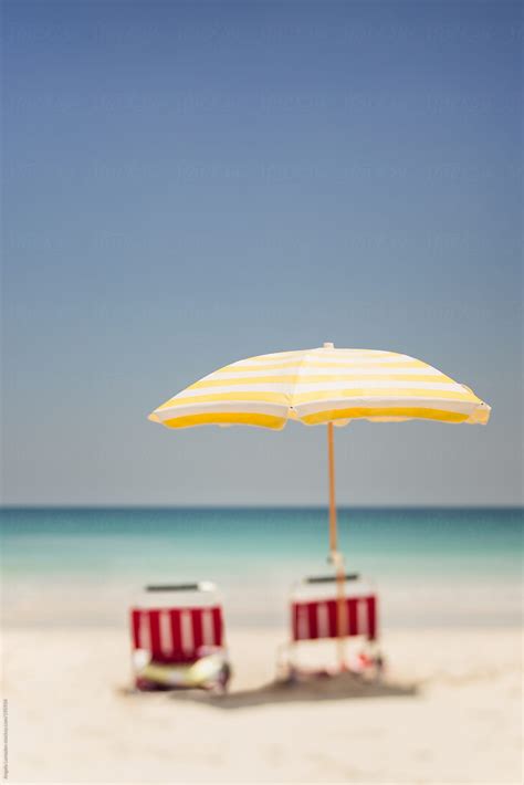 Beach Umbrella And Chairs In The Sand At The Seaside By Stocksy