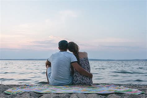 «Young Couple Hugging Outdoor Summer Nature Sunset Beach» del colaborador de Stocksy «Ilya ...