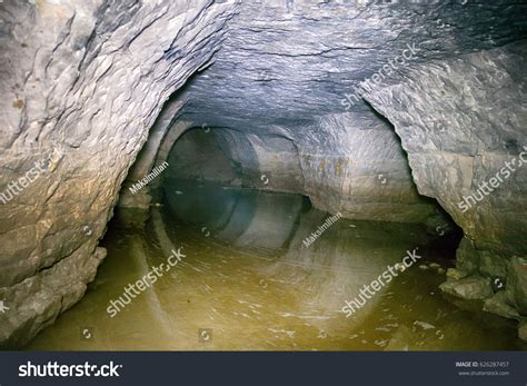 Partially Flooded Underground Caves Catacomb Journey Stock Photo